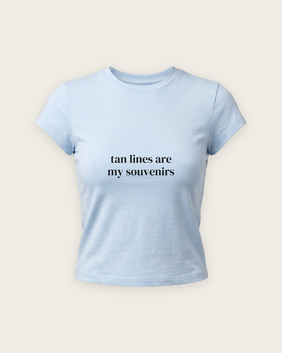 Baby Tee “Tan Lines Are My Souvenirs” — Azul Bebê