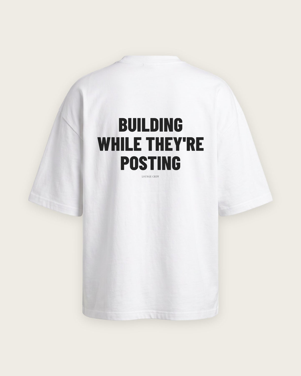 Camiseta Oversized “Building While They're Posting” — Branco